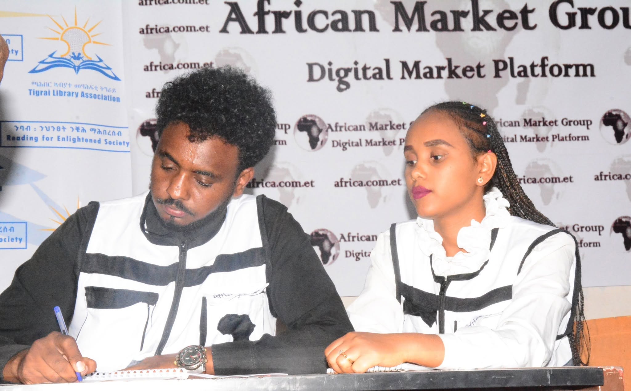 Two African business leaders shaking hands on a partnership